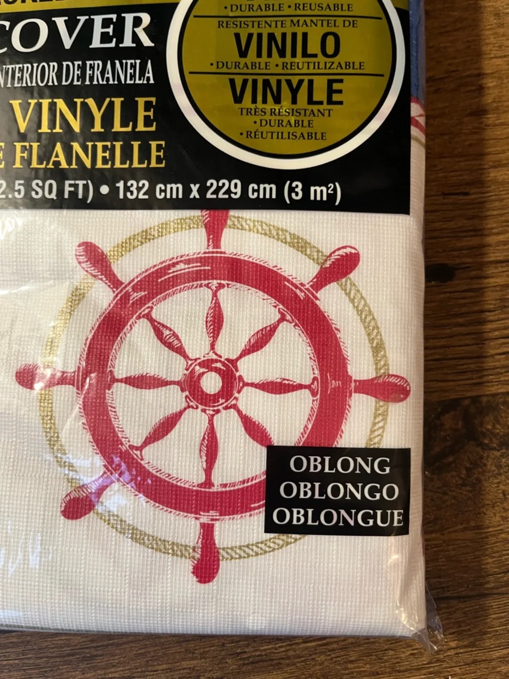 Vinyl Tablecover with Blue Stripes & Red Nautical Wheel Theme from Party City